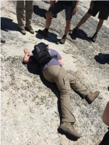 One of the authors getting up close and personal with the rock described in the text. Photo credit: Krystal Park.