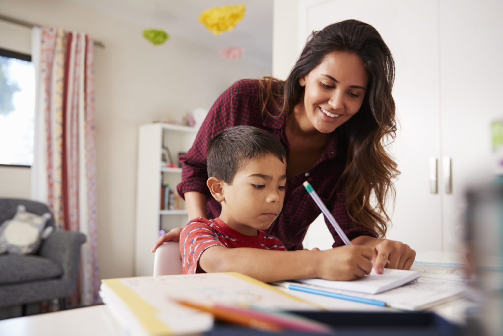 a parent helping a child with homework