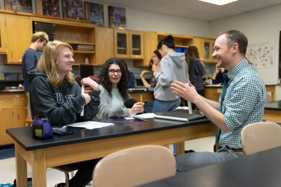 Jordan Pasqualin discussing lesson in classroom at Knowles Teacher Initiative