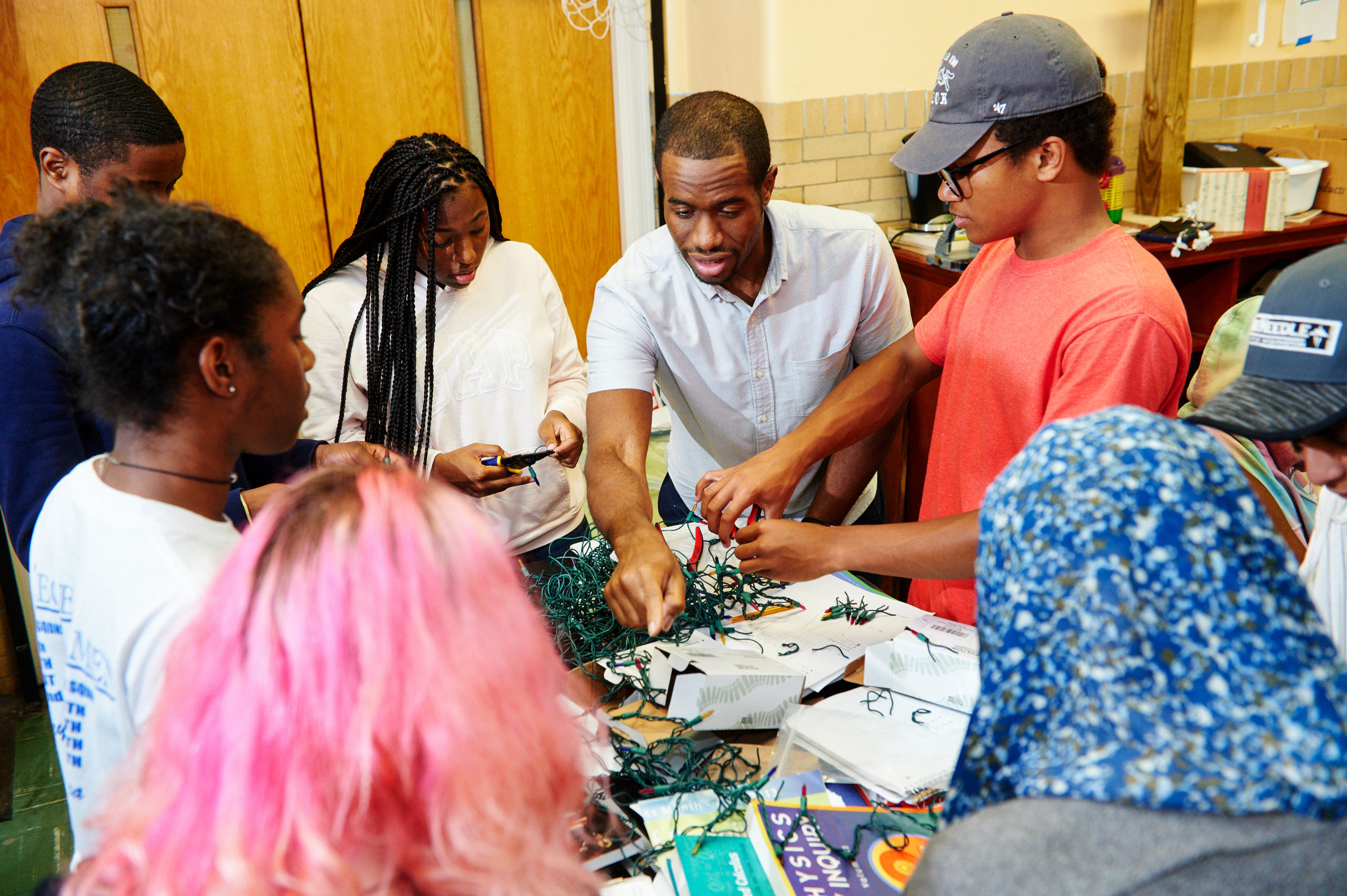 Teaching Fellow and students working on a project at Knowles Teacher Initiative