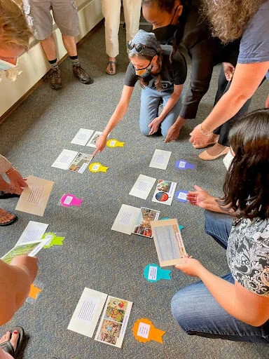 Teachers at Schoodic Institute discussing which award is best to 